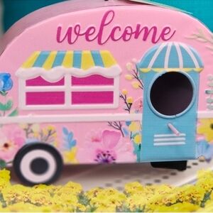 Pink and Blue Birdhouse with Welcome Sign